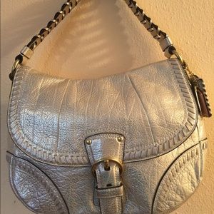 Gold metallic coach bag.